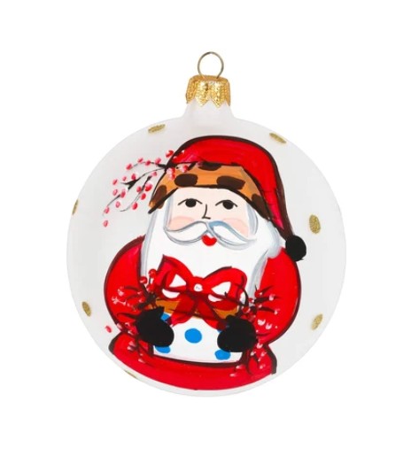 The Kitchen Table 2026 limited edition handpainted glass ornament featuring Old St. Nick holding a gift and red bird.