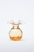 The Kitchen Table Hibiscus glass bud vase in amber with a delicate fluted rim, mouthblown by Tuscan artisans.