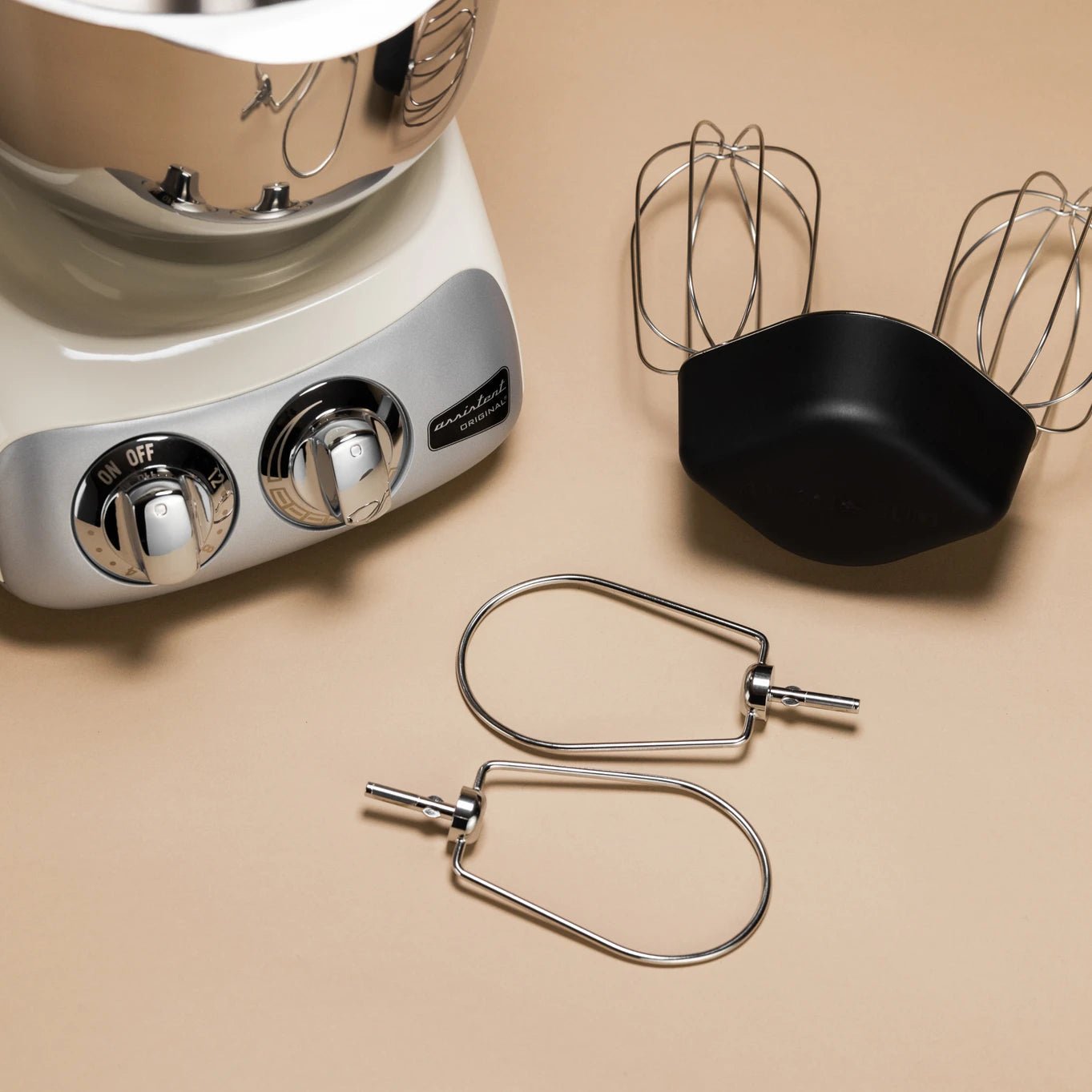 The Kitchen Table Ankarsrum premium beater set with stainless steel bowl, balloon whisks, and cookie beaters.