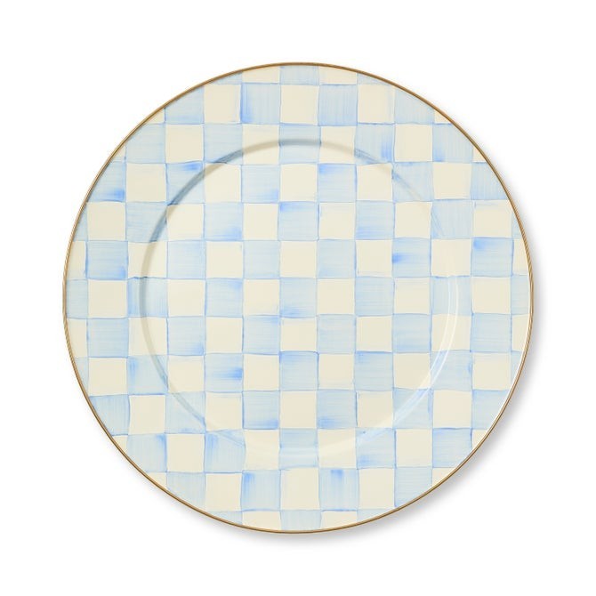 The Kitchen Table enamel dinner plate with a hand-painted blue and white checkered pattern and bronze-tone rim.
