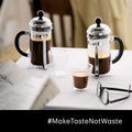 The Kitchen Table Bodum Chambord 8-cup French press coffee makers with glass carafes on a white table with glasses