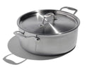 The Kitchen Table EATER 6 quart stainless steel rondeau pan with lid, featuring wide base and sturdy side handles.