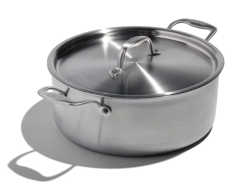 The Kitchen Table EATER 6 quart stainless steel rondeau pan with lid, featuring wide base and sturdy side handles.
