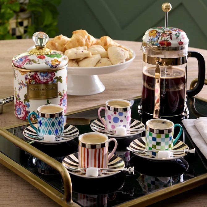 The Kitchen Table set of four espresso spoons with decorative enamel handles featuring colorful checks and stripes.