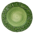 The Kitchen Table Fiabe di Natale green ceramic charger plate with handpainted and sculpted festive holiday motifs.
