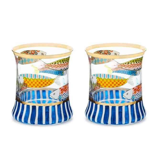 The Kitchen Table Go Fish highball glass set featuring mouth-blown glass with colorful fish motifs and gold trim.