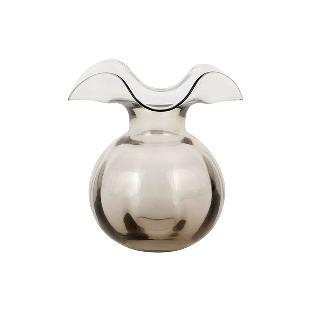 The Kitchen Table Hibiscus glass fluted bud vase in a translucent grey hue with a romantic, mouthblown curved rim.