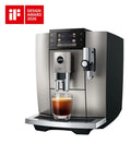 The Kitchen Table Jura E8 Midnight Silver automatic coffee machine with a glass of espresso and iF Design Award logo.