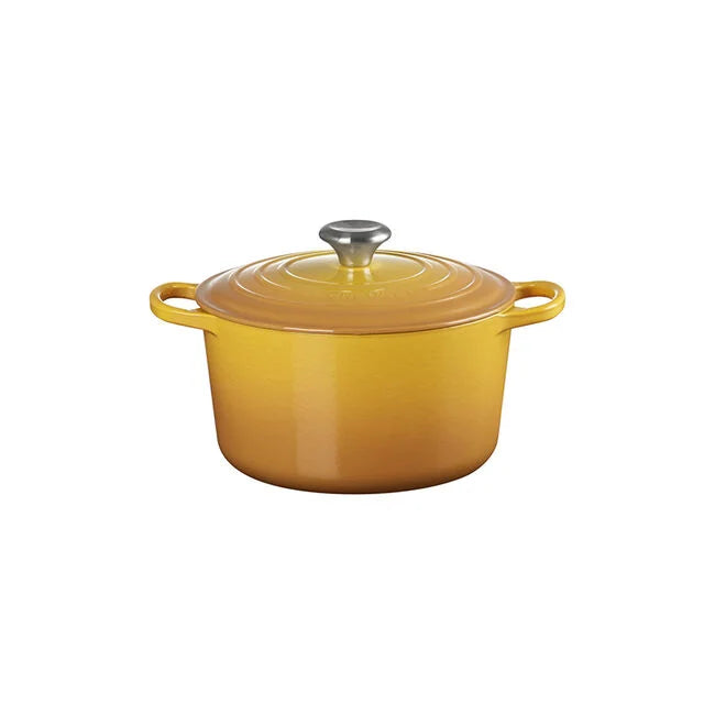 The Kitchen Table Signature Deep Round Oven in yellow enameled cast iron with a matching lid and metal knob.