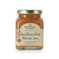 The Kitchen Table Stonewall Kitchen Reserve Mango Passionfruit Habanero Jam in a glass jar with a gold lid.