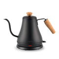 The Kitchen Table MELIOR electric gooseneck kettle in matte black with a sustainable cork handle and lid knob.