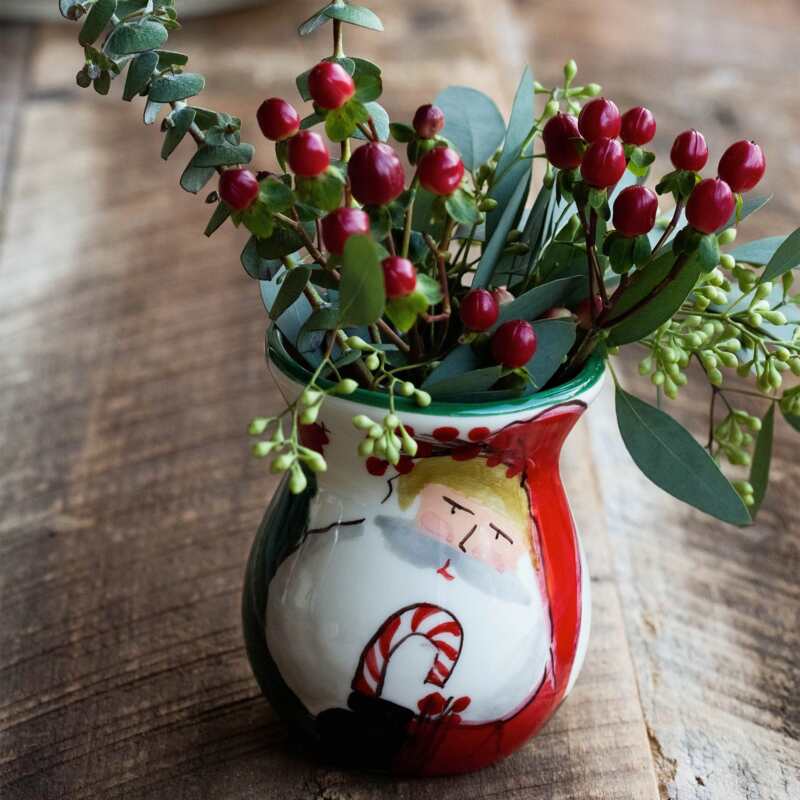 The Kitchen Table Old St. Nick ceramic bud vase featuring a hand-painted Santa Claus design with a candy cane