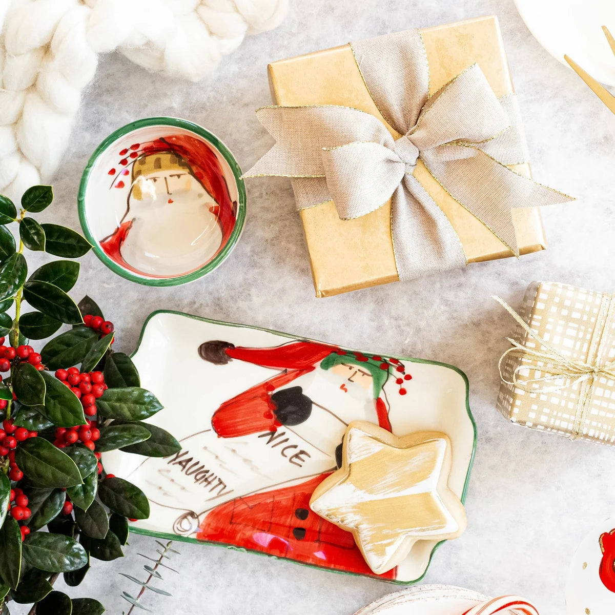 The Kitchen Table Old St. Nick ceramic condiment bowl and tray set featuring whimsical Santa Claus holiday designs.
