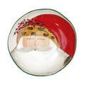 Vietri hand-painted ceramic pasta bowl featuring Papa Natale in an animal print hat with holly.