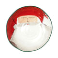 The Kitchen Table Old St. Nick pasta bowl featuring a hand-painted red hat Santa Claus design on a white ceramic base.