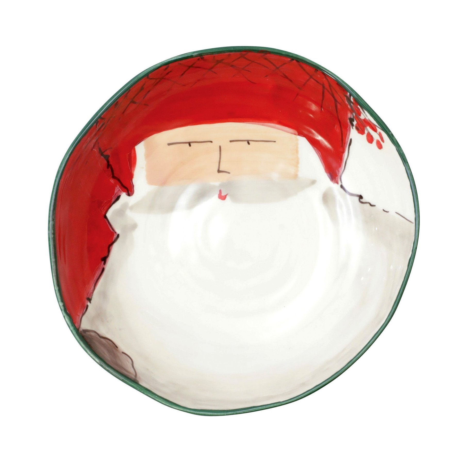 The Kitchen Table Old St. Nick pasta bowl featuring a hand-painted red hat Santa Claus design on a white ceramic base.