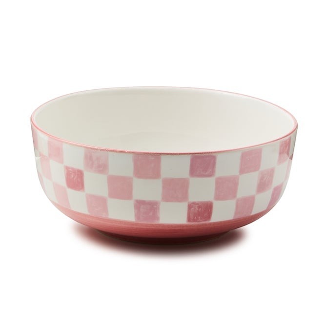 The Kitchen Table stoneware serving bowl with a pink and white checkered pattern and a hand-painted pink rim.