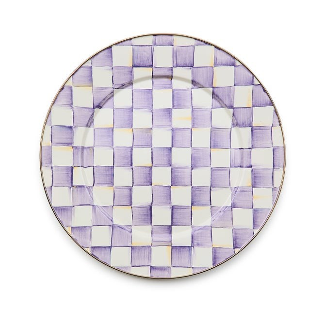 The Kitchen Table enamel dinner plate with a hand-painted purple and white checkered pattern and bronze-tone rim.