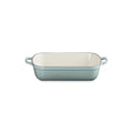 The Kitchen Table Le Creuset Signature rectangular enameled cast iron roaster in a soft blue finish with wide loop handles.