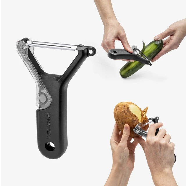 The Kitchen Table Dreamfarm Sharple Y-Peeler with self-sharpening blade and ergonomic black handle peeling produce.