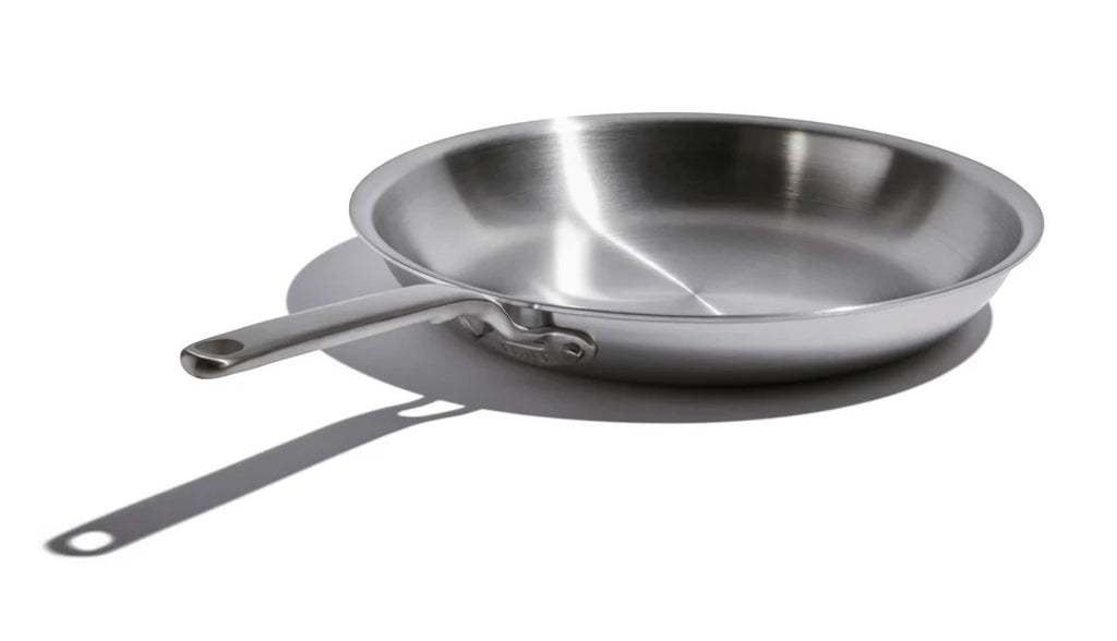 The Kitchen Table 12-inch stainless steel fry pan with a durable, fully clad design for even heat distribution.
