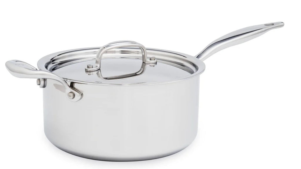 The Kitchen Table 4 quart stainless steel saucepan with a polished finish, riveted handle, and a tight-fitting lid.