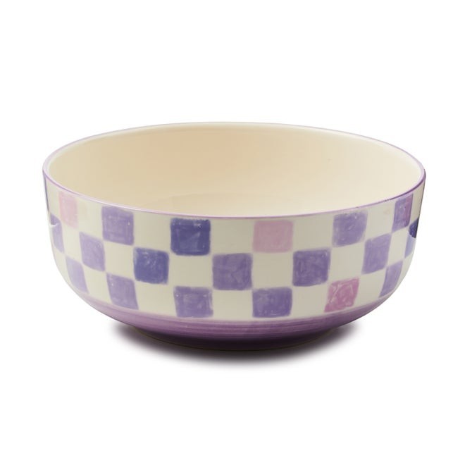 The Kitchen Table stoneware serving bowl with a purple and pink watercolor checkerboard pattern and hand-painted rim.