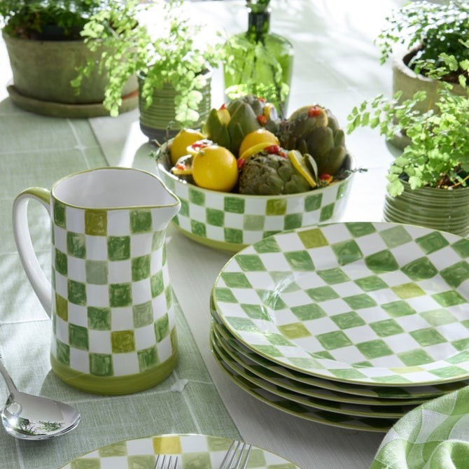 The Kitchen Table stoneware serving bowl with a green and white watercolor-inspired checkered pattern and painted rim.