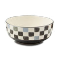 The Kitchen Table stoneware serving bowl with a watercolor-inspired checkered pattern and a hand-painted rim.