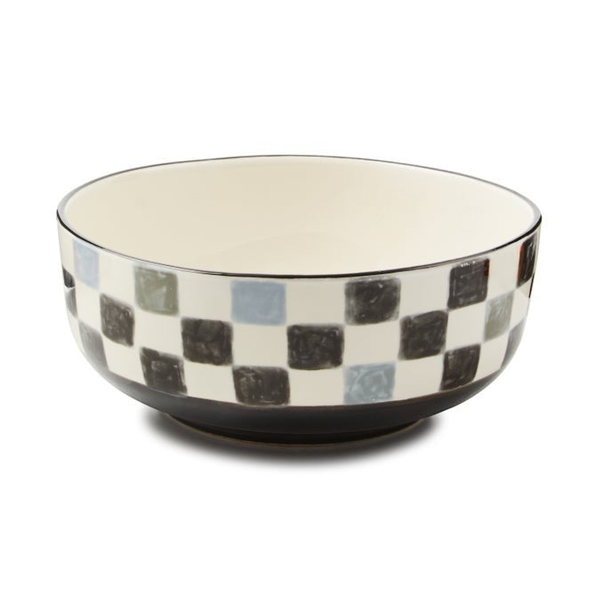 The Kitchen Table stoneware serving bowl with a watercolor-inspired checkered pattern and a hand-painted rim.