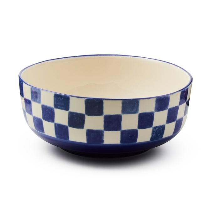 The Kitchen Table stoneware serving bowl featuring a blue and white checkered pattern and a hand-painted rim.
