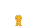 The Kitchen Table yellow Smiley Hoptimist figurine with a spring base and a cheerful beaming smile
