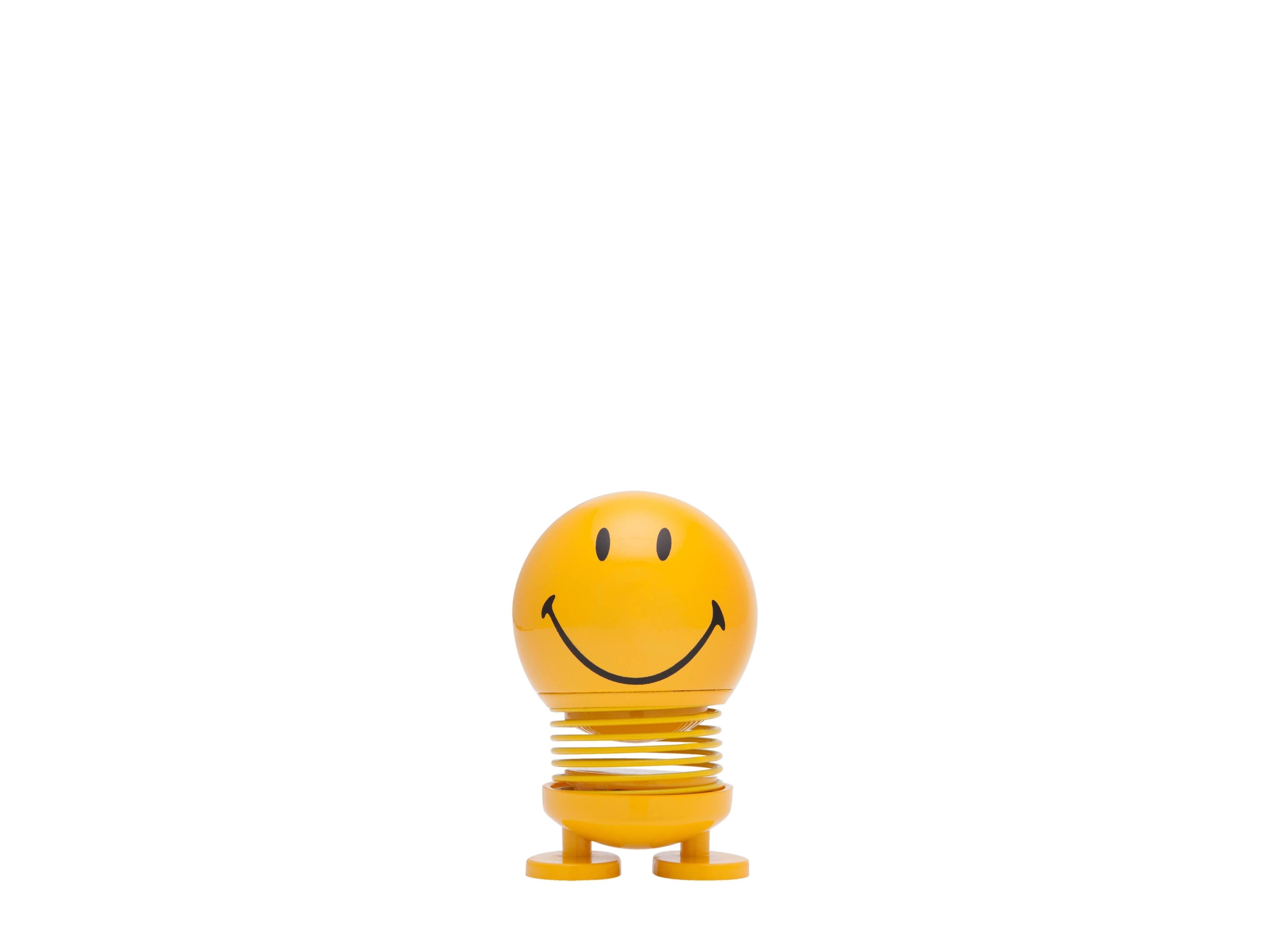 The Kitchen Table yellow Smiley Hoptimist figurine with a spring base and a cheerful beaming smile